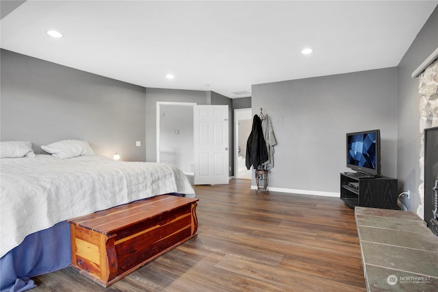 bedroom featuring dark hardwood / wood-style flooring