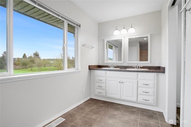 bathroom featuring vanity and tile patterned flooring