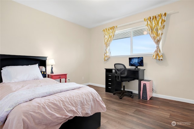 bedroom with wood-type flooring