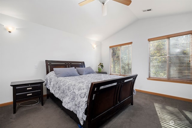 bedroom featuring dark carpet, vaulted ceiling, and ceiling fan