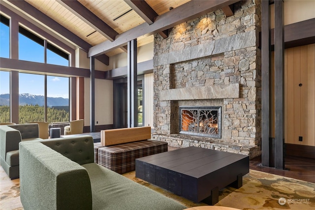 3600 Suncadia Trl Unit 5040, Cle Elum, WA 98922 - interior space with wood finished floors, vaulted ceiling with beams, wooden ceiling, a mountain view, and a fireplace