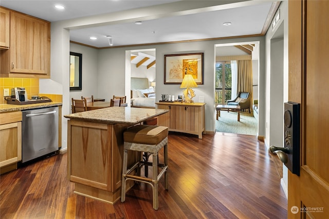 kitchen with tasteful backsplash, a center island, dark hardwood / wood-style flooring, stainless steel dishwasher, and crown molding