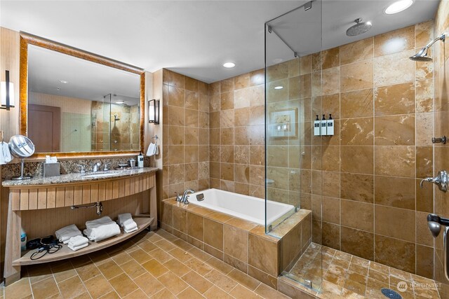 bathroom with vanity, tile patterned floors, and shower with separate bathtub