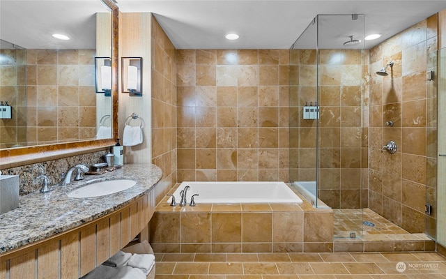 3600 Suncadia Trl Unit 5040, Cle Elum, WA 98922 - full bathroom featuring a stall shower, tile walls, recessed lighting, a garden tub, and vanity