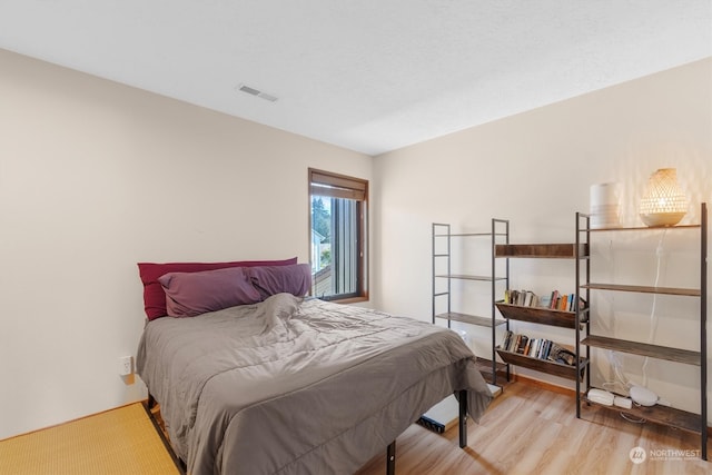 bedroom with light hardwood / wood-style flooring