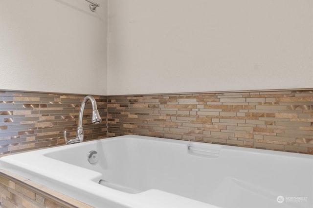 interior details featuring a relaxing tiled tub