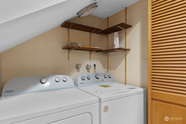 washroom with washer and dryer