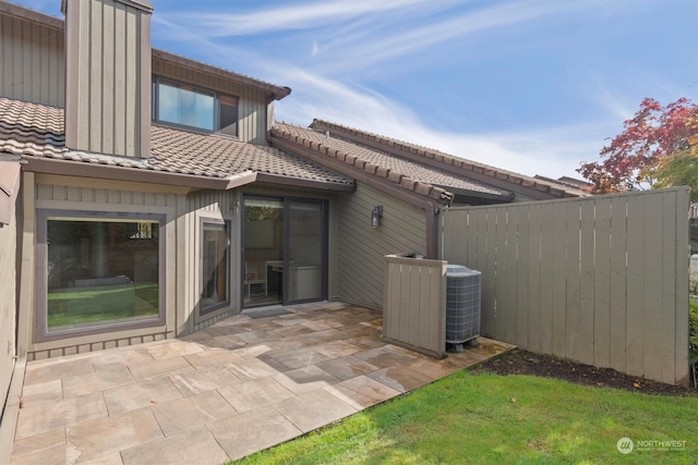 back of property featuring a patio and central AC unit