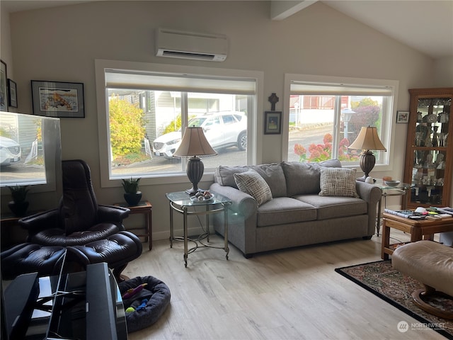 living room with light hardwood / wood-style flooring, lofted ceiling, a wealth of natural light, and a wall unit AC