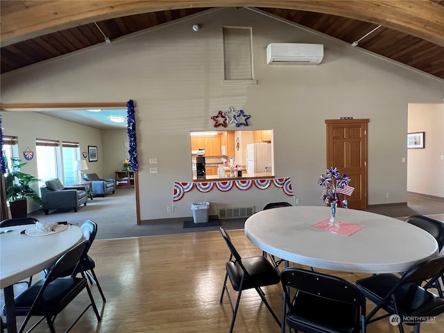 dining area featuring wood ceiling, hardwood / wood-style floors, high vaulted ceiling, a wall mounted air conditioner, and beamed ceiling