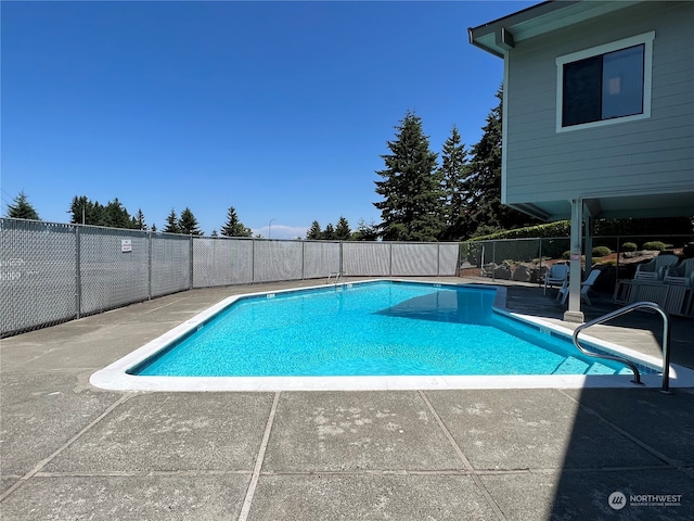 view of pool featuring a patio