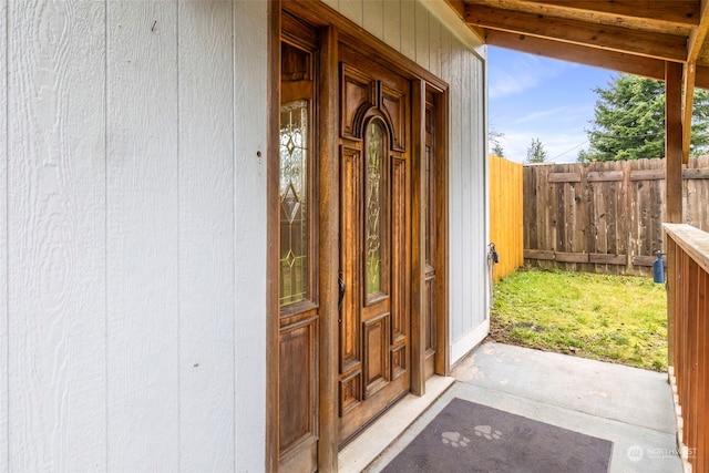 view of exterior entry featuring a porch