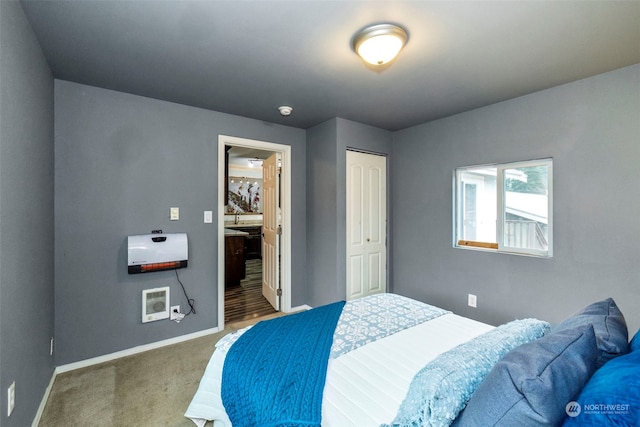 carpeted bedroom with a closet