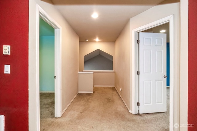 hallway with light colored carpet