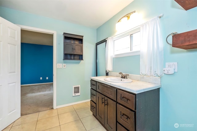 bathroom with vanity, heating unit, and tile patterned floors