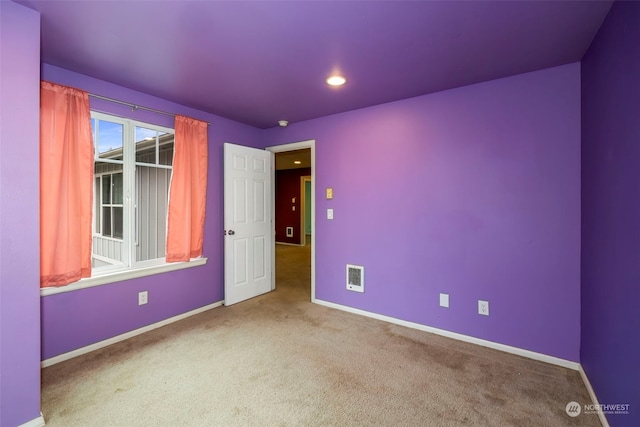 unfurnished room featuring carpet floors