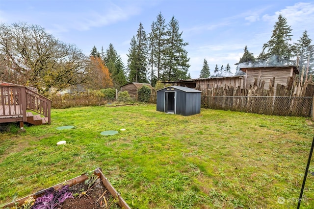 view of yard with a wooden deck and a shed