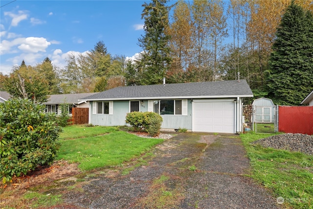 ranch-style house with a front lawn and a garage