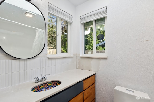 bathroom featuring vanity and toilet