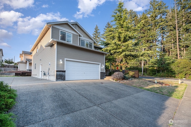 view of side of home featuring a garage