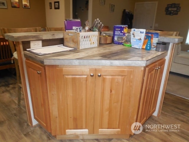 bar with light hardwood / wood-style flooring