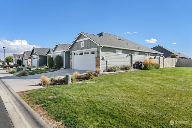 view of side of property with a garage and a yard