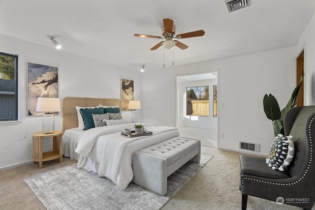 carpeted bedroom with ceiling fan