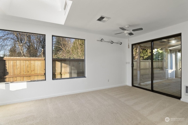 carpeted empty room with ceiling fan