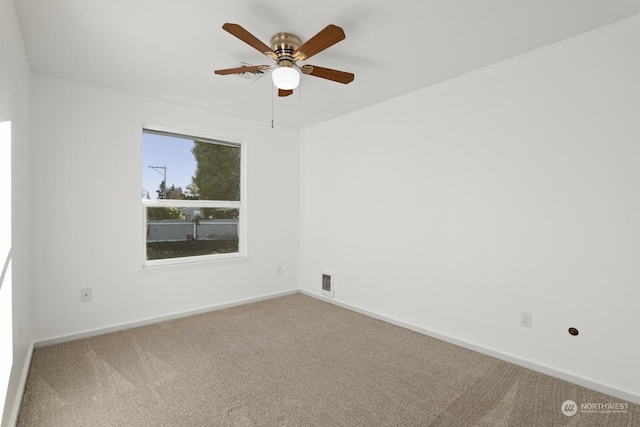 carpeted empty room with ceiling fan