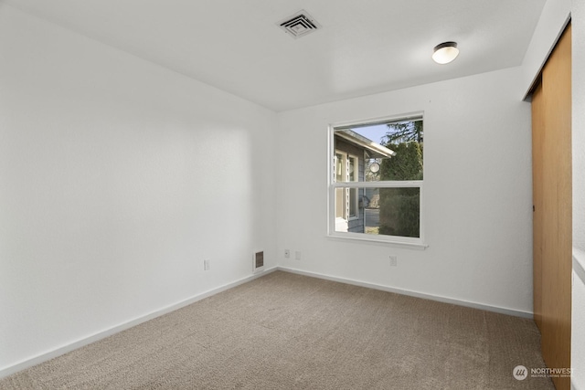 empty room featuring carpet flooring