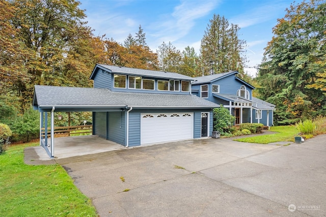 view of front property featuring a front yard, a garage, and a carport