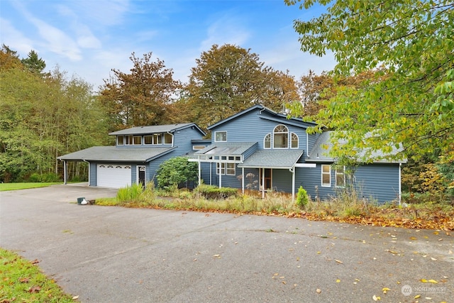 front facade featuring a garage and a porch