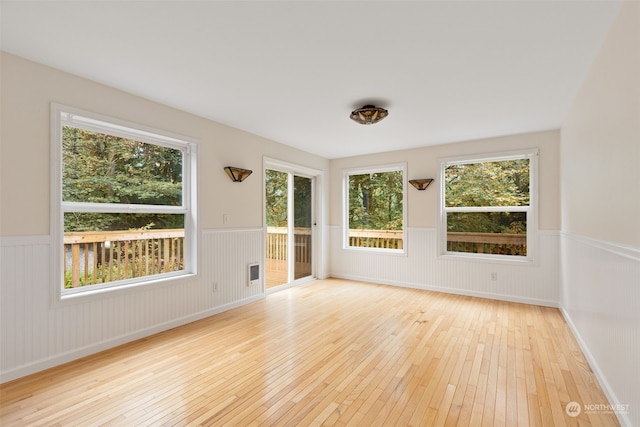 spare room featuring light hardwood / wood-style floors