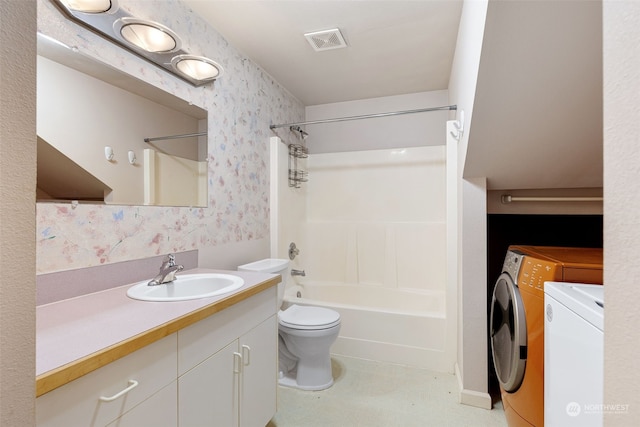 full bathroom with vanity, independent washer and dryer, shower / bath combo, and toilet