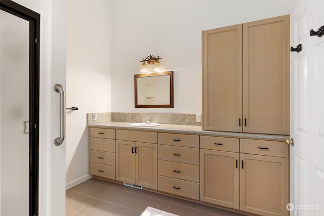 bathroom with vanity and tile patterned floors