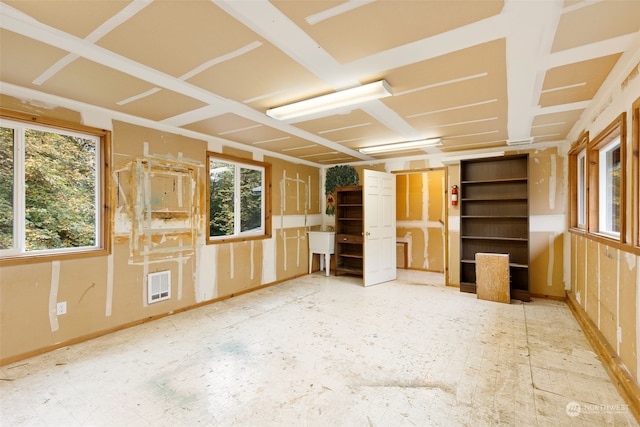 unfurnished living room with plenty of natural light