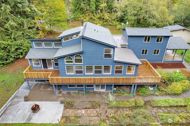 rear view of house featuring a carport