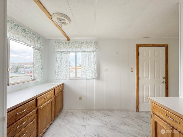 bathroom featuring vanity, a textured ceiling, and wooden walls