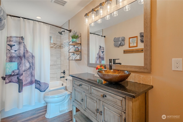 full bathroom featuring vanity, toilet, shower / bath combo, and hardwood / wood-style floors