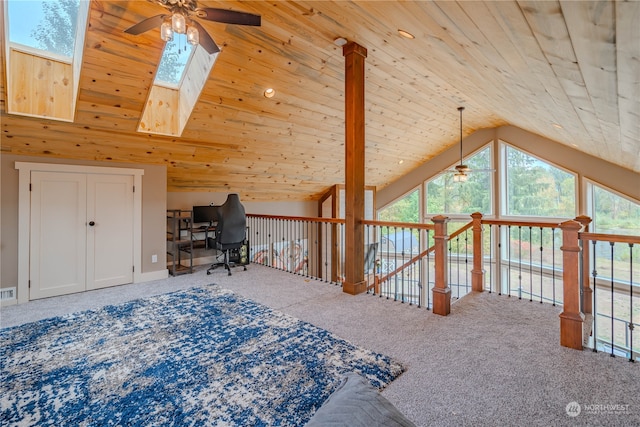 carpeted bedroom featuring high vaulted ceiling, wooden ceiling, a skylight, and ceiling fan