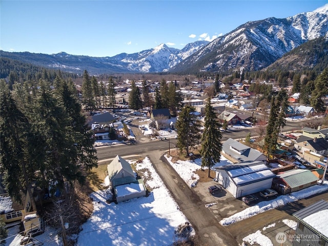 drone / aerial view featuring a residential view and a mountain view