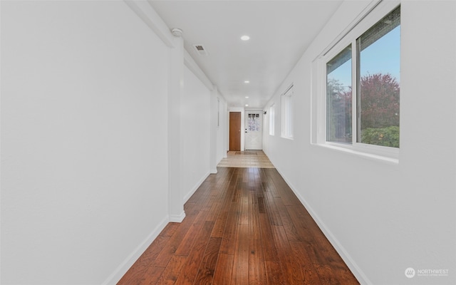 hall with wood-type flooring