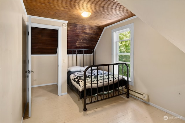 bedroom featuring lofted ceiling, light hardwood / wood-style floors, and wooden ceiling