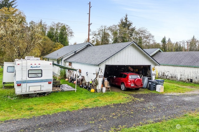 exterior space featuring a front lawn and a garage