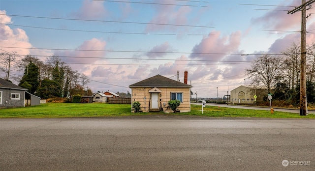 bungalow-style house featuring a yard