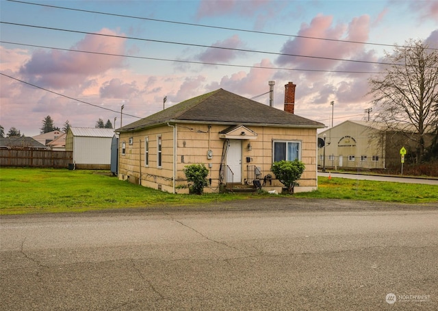 view of front of home with a lawn