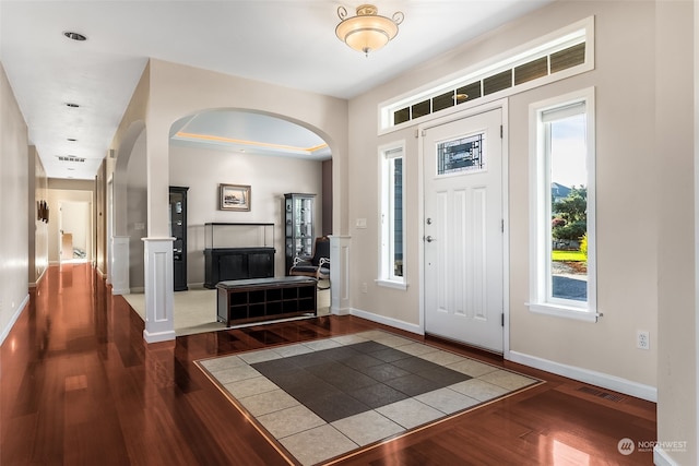 entrance foyer with dark hardwood / wood-style floors