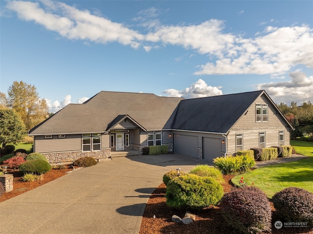 view of front of house featuring a front yard and a garage