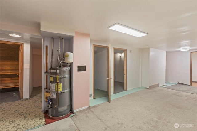 basement with carpet and secured water heater