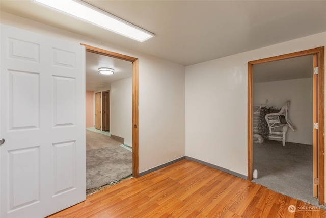 unfurnished room with light hardwood / wood-style floors